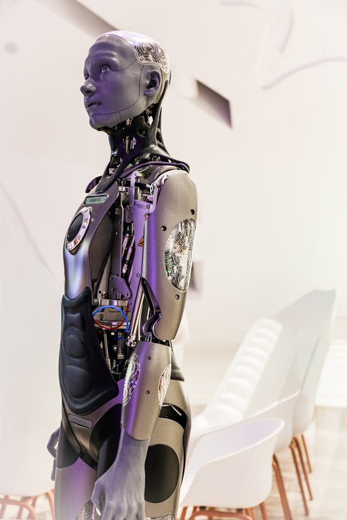 ours-journey Sleek humanoid robot displayed in a contemporary conference setting, showcasing advanced technology.